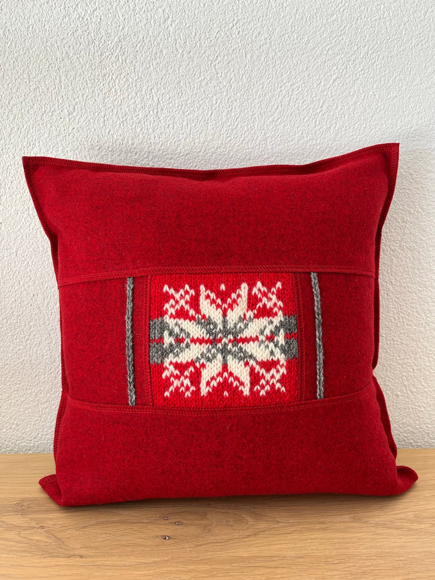 Cushion cover with handknitted details, red